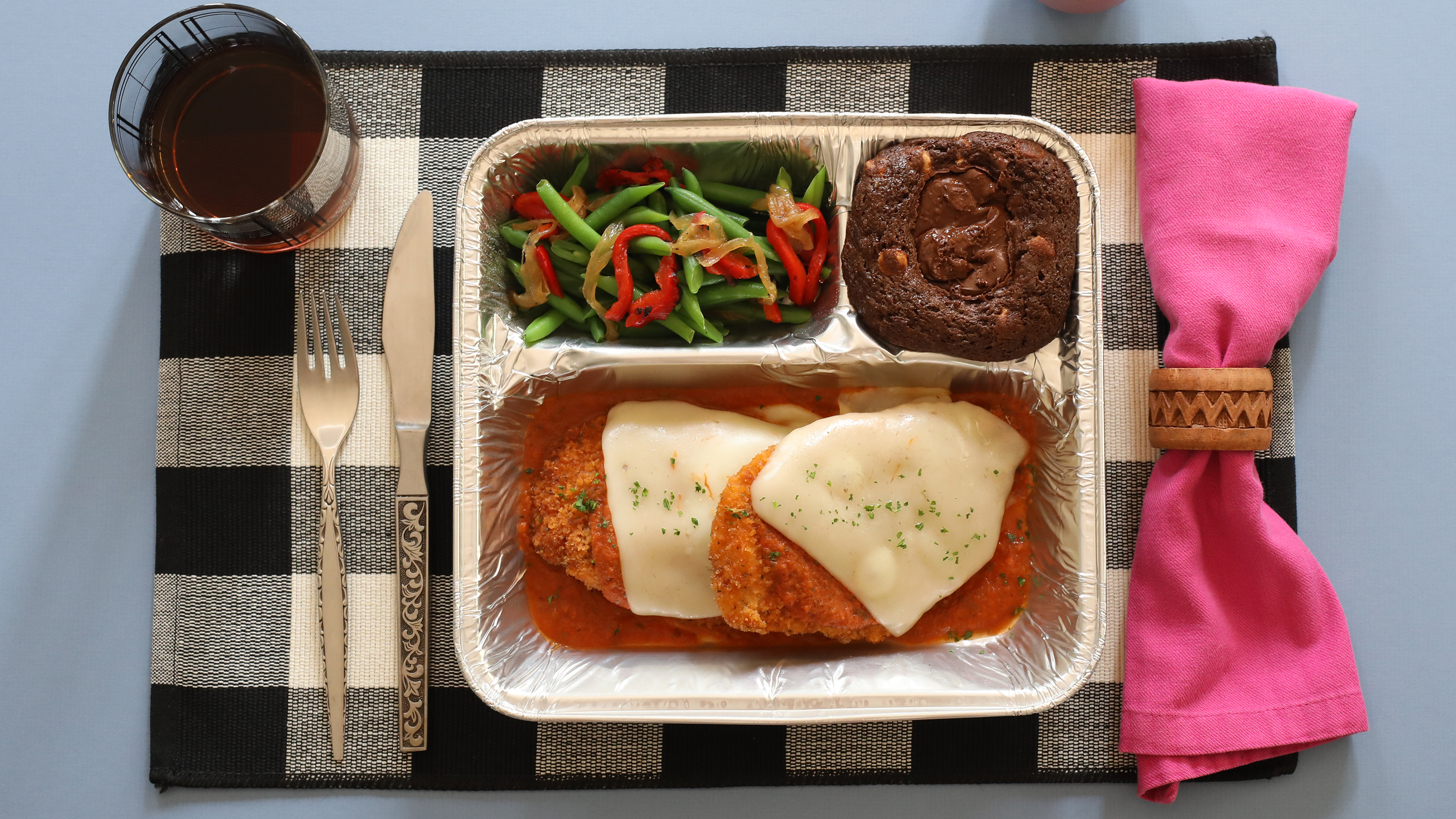 TV Dinner Chicken Parmesan on a place setting